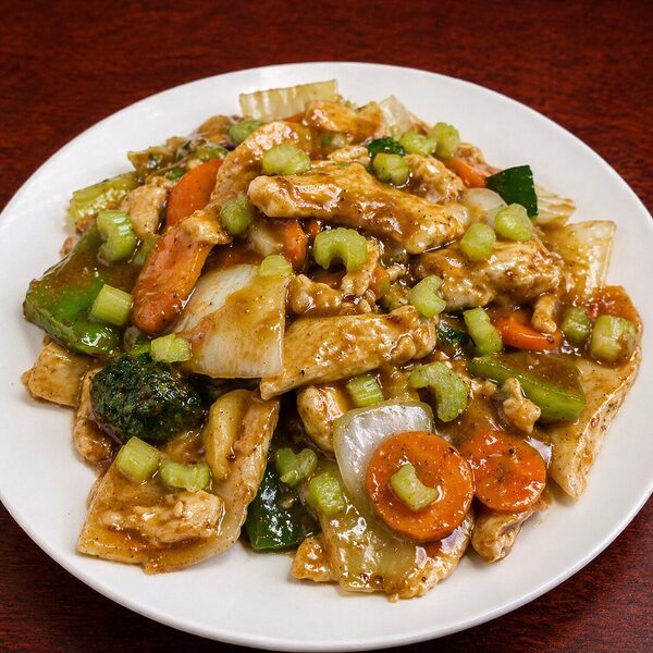 Chicken stir-fry with carrots, broccoli, celery, and onions in a savory sauce