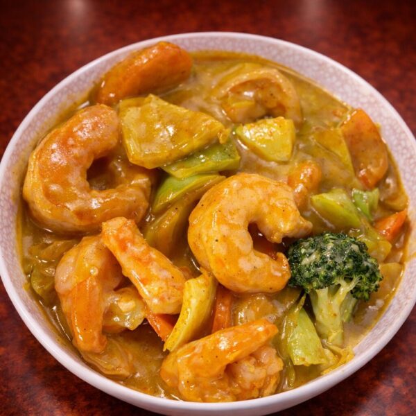 Bowl of shrimp curry with broccoli and vegetables in a savory sauce